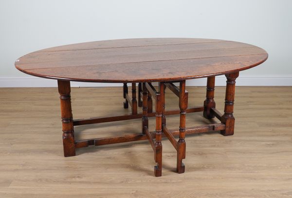 A LARGE 17TH CENTURY OAK DOUBLE GATE-LEG ACTION DROP LEAF DINING TABLE