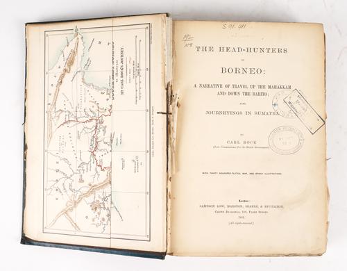 BOCK, Carl (1849-1932). The Head-Hunters of Borneo, London, 1881, large 8vo, folding map, 30 lithographed plates, of which 28 coloured, illustrations (some staining), original coloured pictorial cloth gilt (partly disbound). FIRST EDITION.