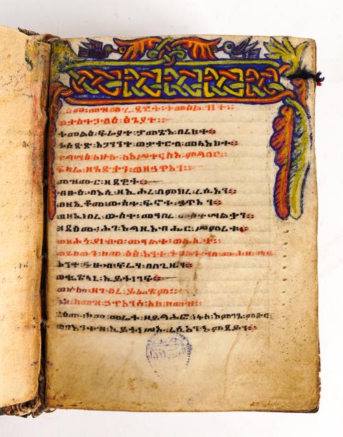 Ethiopian manuscript on c.165 vellum leaves, Ge'ez script in red and black, 22-lines to each page, with 18 ornamental coloured strapwork and foliate headpieces, contemporary vellum over boards, 125 x 90mm., [?]19th-century.