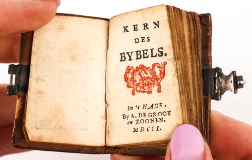 MINIATURE BIBLE, Dutch - Kern des Bybels, The Hague, 1750, 42 x 30mm., printed in red and black, 7 woodcut plates printed in red, contemporary calf gilt, metal clasp. RARE.