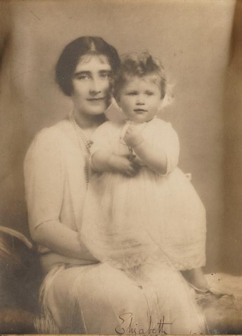 QUEEN ELIZABETH, The Queen Mother (1900-2002). A portrait photograph of The Queen Mother with Elizabeth, future Queen Elizabeth II, signed "Elizabeth 1927". With other Royal material. Please see the full description. (qty)