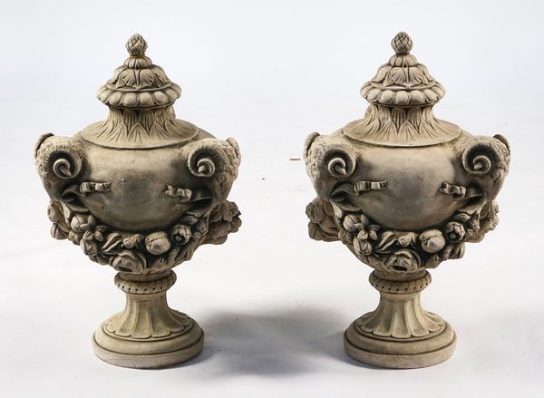 A PAIR OF RECONSTITUTED STONE URN FINIALS