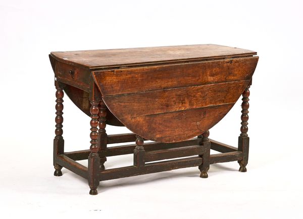 A CHARLES II JOINED FRUITWOOD GATELEG DINING TABLE