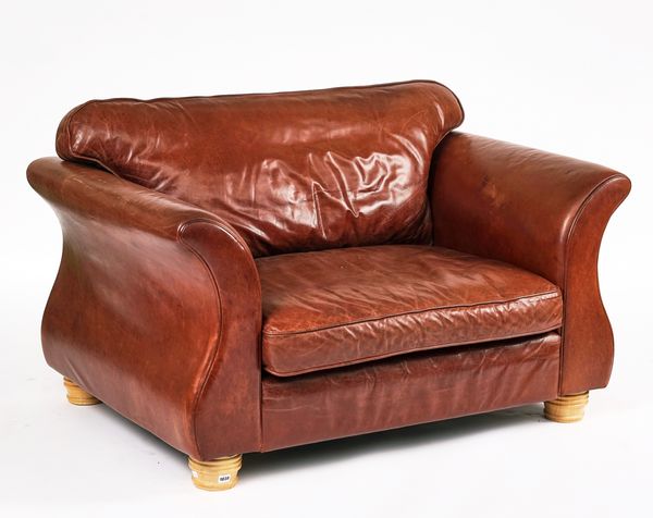 ‘MICHAEL TYLER’: A RAJAH MODEL LEATHER UPHOLSTERED TWO SEAT SOFA