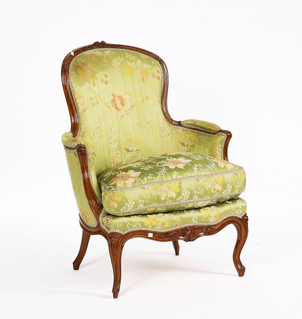 A LOUIS XV CARVED BEECH FRAMED TUB BACK ARMCHAIR