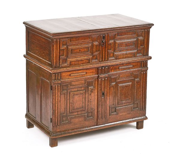 A CHARLES II JOINED OAK ENCLOSED CHEST OF DRAWERS