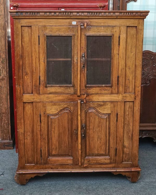 AN INDIAN TEAK TWO DOOR FOOD CUPBOARD