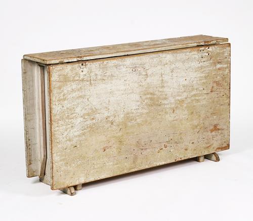 AN EARLY 19TH CENTURY GREY PAINTED GUSTAVIAN PINE DROP FLAP TABLE