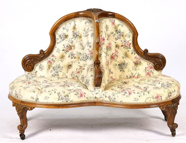 A VICTORIAN WALNUT FRAMED CONVERSATION SOFA