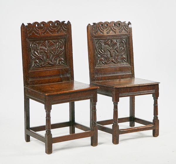 A PAIR OF CHARLES II JOINED OAK BACKSTOOLS