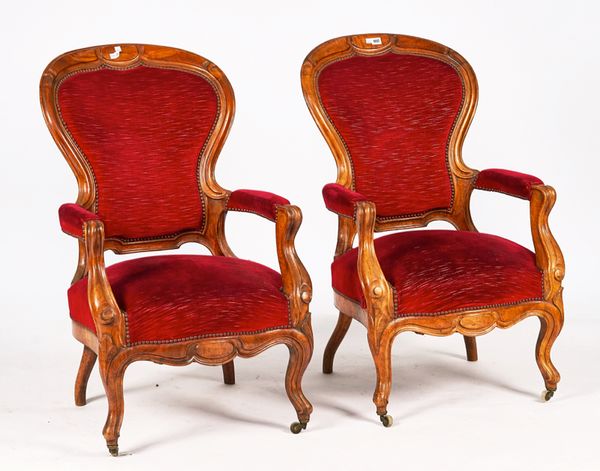 A PAIR OF 19TH CENTURY FRENCH WALNUT FRAMED SPOON BACK OPEN ARMCHAIRS
