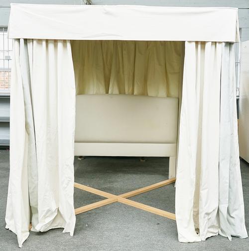 A MODERN CREAM UPHOLSTERED FOUR POSTER BED FRAME