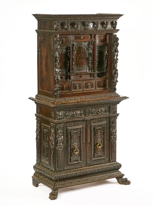 A RENAISSANCE REVIVAL STAINED WALNUT CABINET-ON-STAND