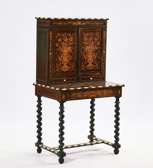 A LATE 19TH CENTURY DUTCH FLORAL MARQUETRY AND EBONISED CABINET ON STAND