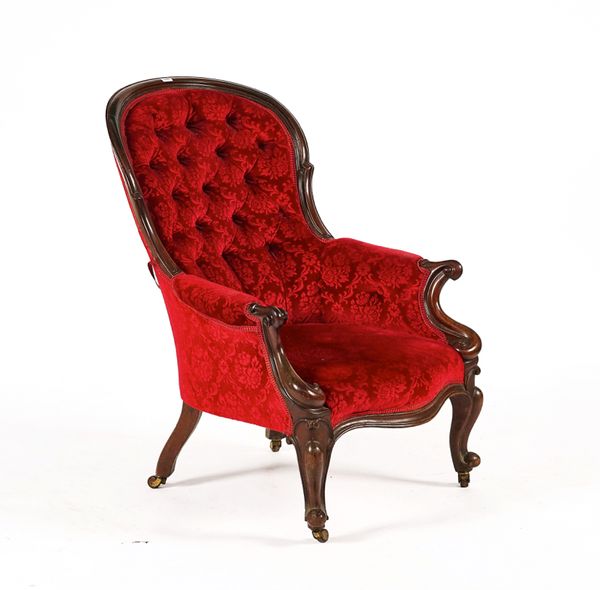 A VICTORIAN MAHOGANY SPOON BACK EASY ARMCHAIR