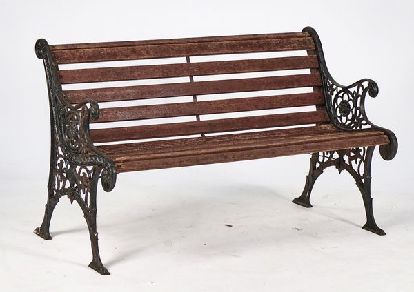 AN EARLY 20TH CENTURY BLACK PAINTED CAST-IRON BENCH