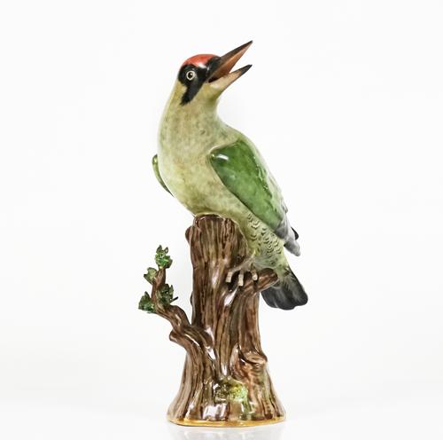 A Meissen model of a green woodpecker