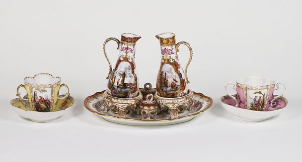 A Dresden cruet set and two German cups and saucers