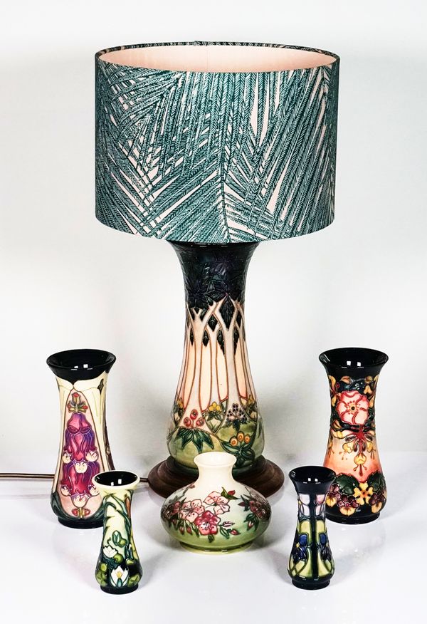 A Moorcroft `Cluny' pattern lamp base and five Moorcroft vases