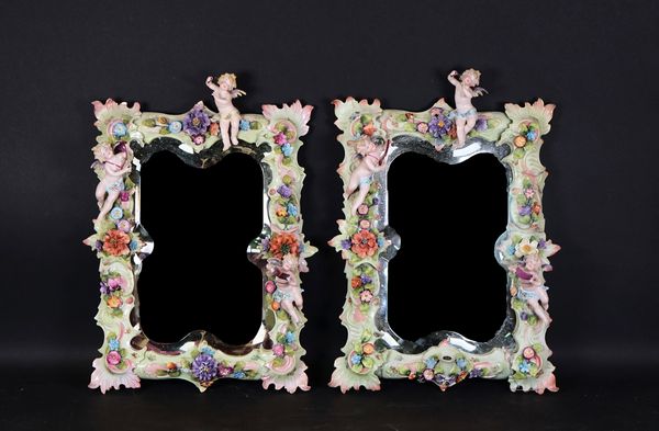 A pair of Dresden porcelain framed rectangular mirrors