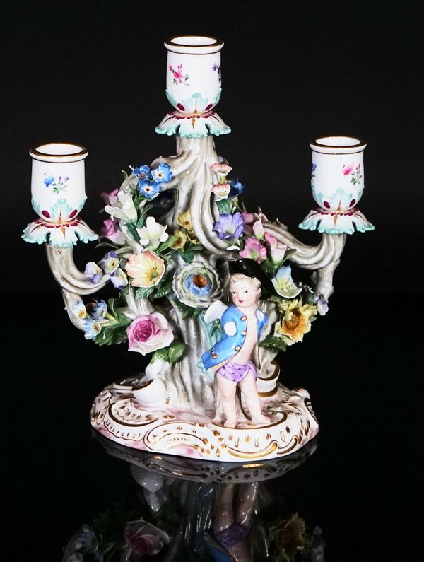 A Meissen  three-light candlestick group