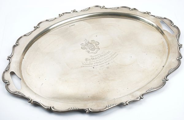 A silver shaped oval twin handled tray