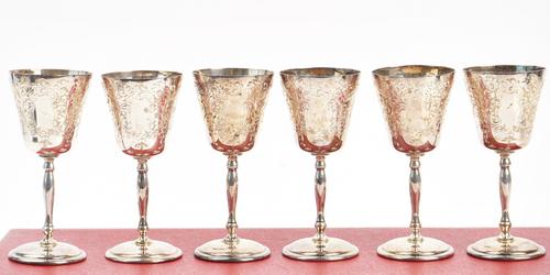 A set of six silver sherry or port goblets