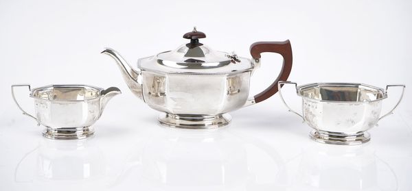 A silver three-piece tea set