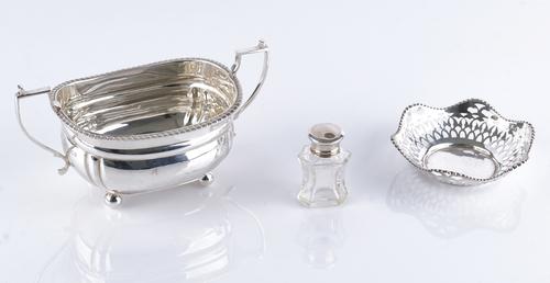 A silver twin handled sugar bowl and two further items (3)