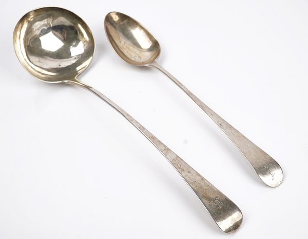 A silver soup ladle and a silver stuffing spoon (2)