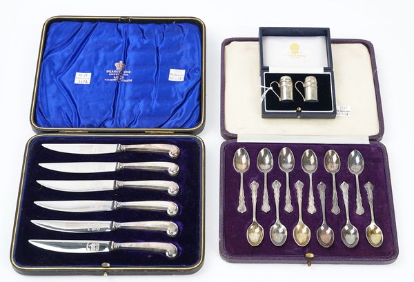 Twelve silver coffee spoons and two further items in three cases (3)