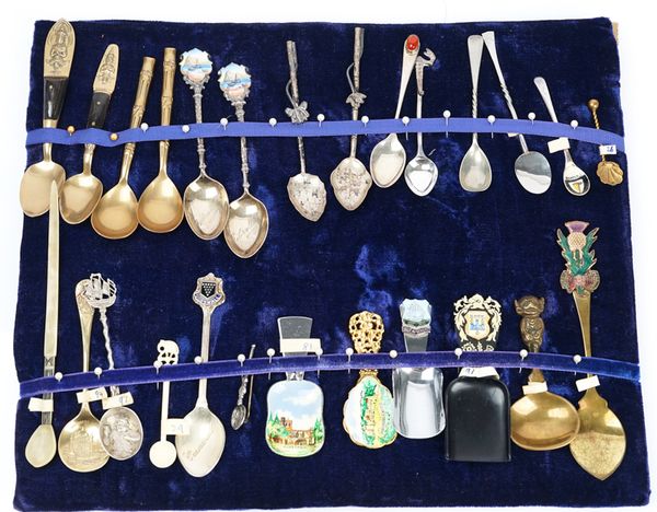 A collection of approx 200 silver foreign and plated souvenir spoons