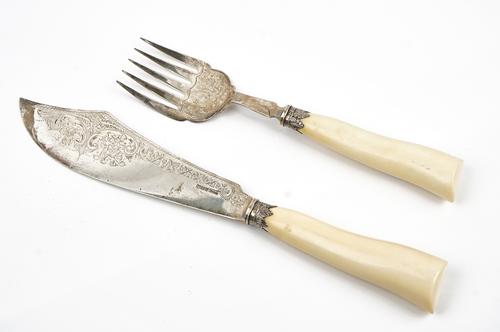A pair of late Victorian silver fish servers