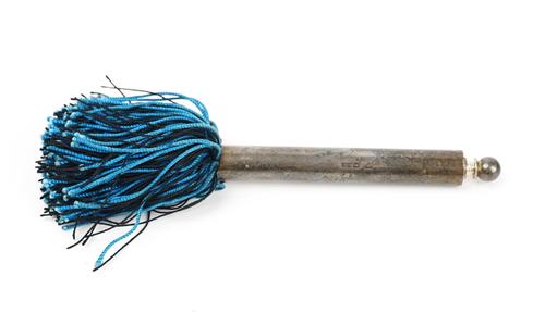 A small silver extending fly whisk