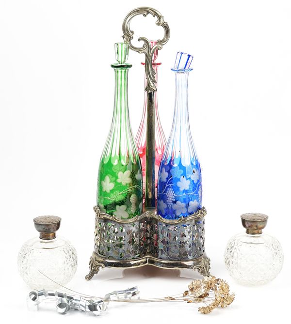 silver plated 3 bottle stand, two silver top bottles and silver flower.