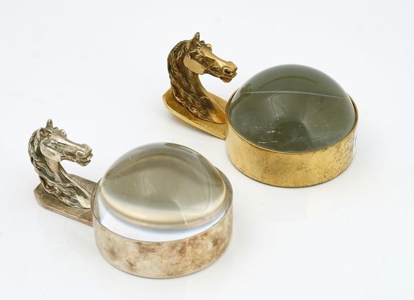 A gilt metal magnifying glass paperweight by Hermes Paris and another paperweight (2)