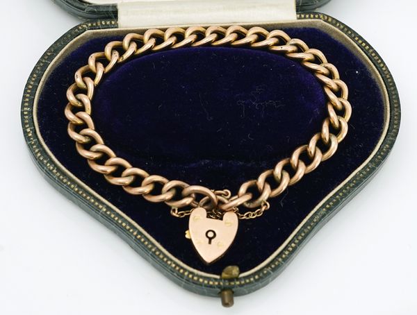 A gold hollow curb link bracelet