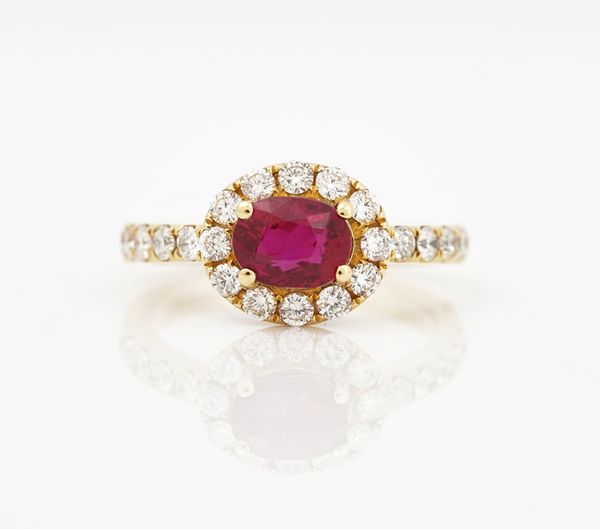 An 18ct yellow gold, ruby and diamond set cluster ring
