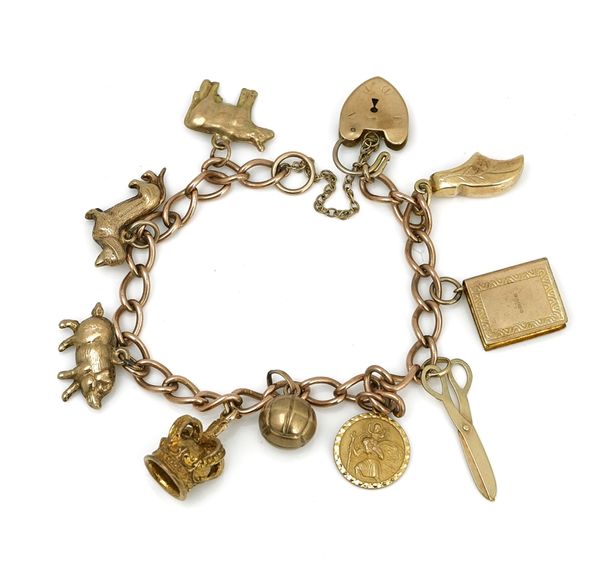 A 9ct gold curb link charm bracelet on a 9ct gold heart shaped padlock clasp
