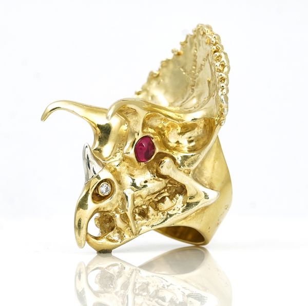 An 18ct  gold, diamond and cabochon ruby ring