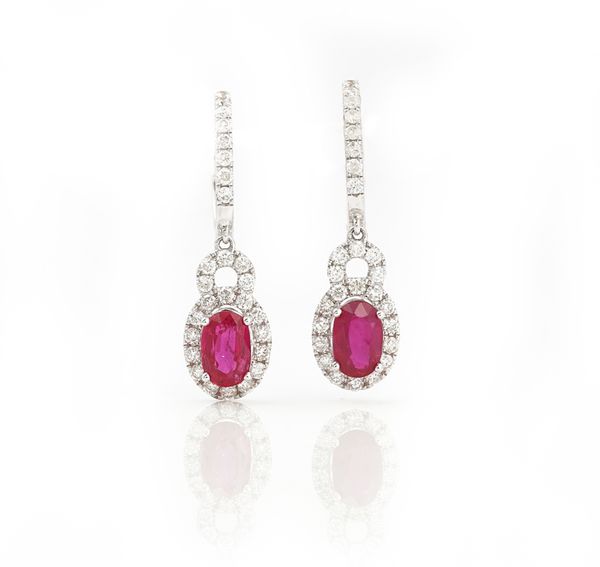 A pair of 18ct white gold, ruby and diamond set pendent earrings