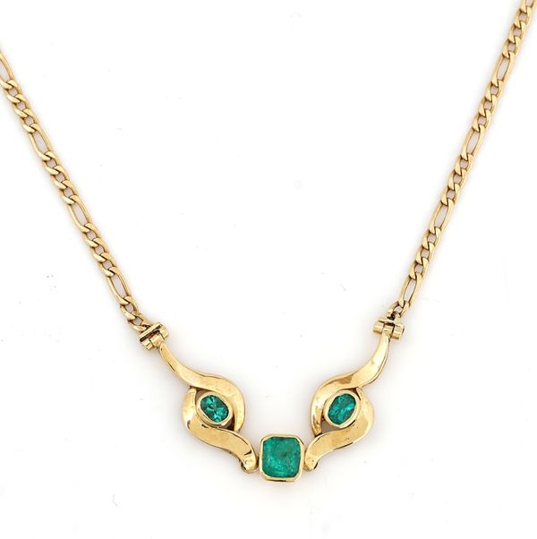 A gold and emerald necklace