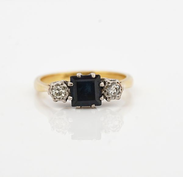 A gold and platinum, sapphire and diamond three stone ring
