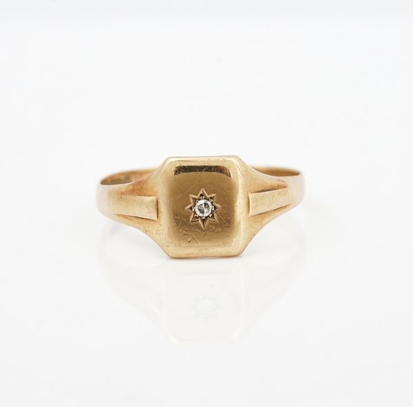 A 9ct gold and diamond set single stone signet style ring