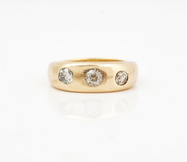 A gold and diamond set three stone ring
