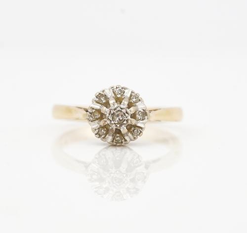 An 18ct gold and diamond nine stone cluster ring