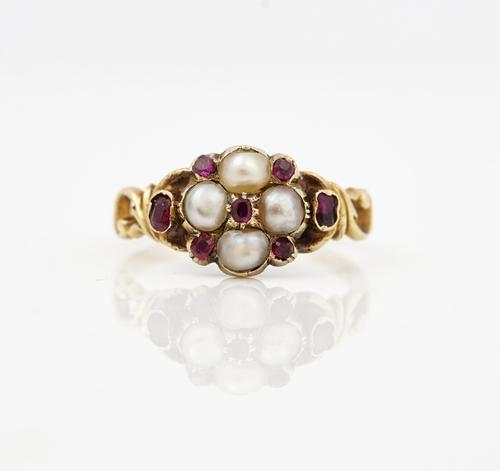 A Victorian gold, ruby and half pearl set ring