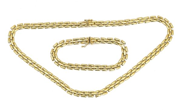 A gold necklace and a gold bracelet, in a matching design (2)