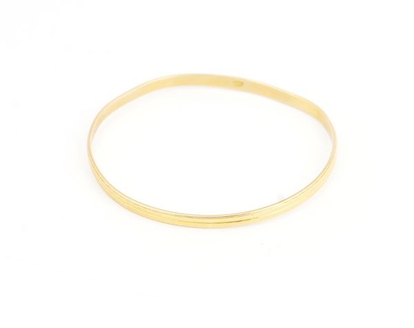 A Middle Eastern gold bangle