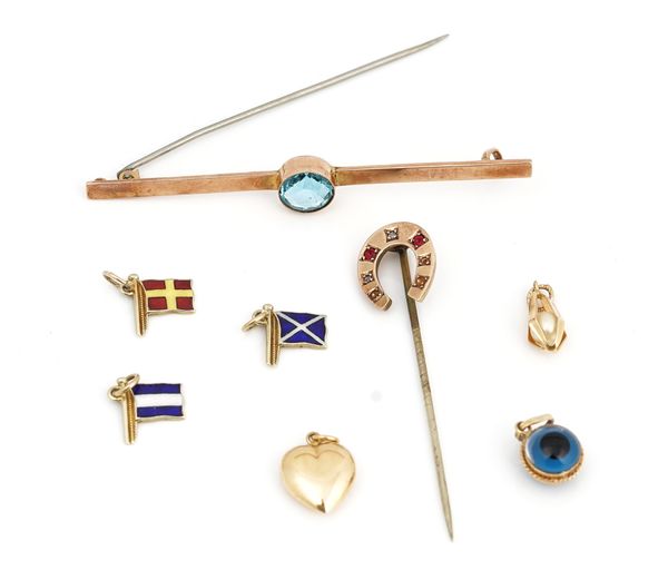 A gold and pale blue gem set solitaire bar brooch and seven further gold mounted items (8)